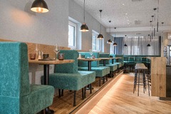 Hoteleigenes À la carte Restaurant unGXUND Ansicht Barbereich