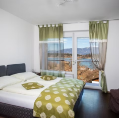 Familienzimmer mit Seeblick - Hotel Faaker See Inn